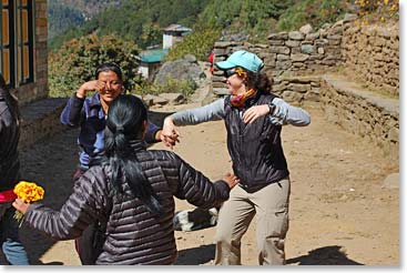 Jennie dancing with local women