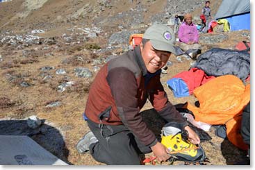 At base camp we got our gear ready. DaSona helping make sure Raquel’s crampons are adjusted well.