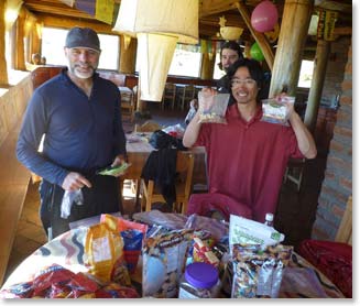 Bill and Yuki pick out their favorite snacks to bring up Cotopaxi.