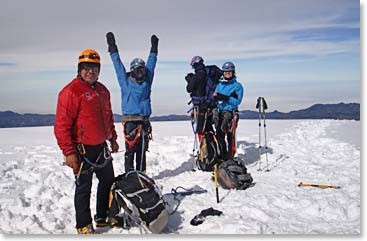 Yuki, Ana, Andrew and Joaquin stand on the summit together!