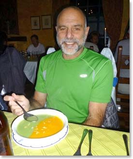 Bill having a gourmet dinner with a soup that matches his shirt!