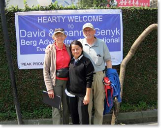 The team takes a quick moment to pose for a photo in from of their welcome banner at the hotel.