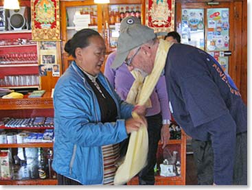 Lakpa Doma at the Panaroma Lodge in Namche offers Dave a farewell Khata blessing scarf the morning the team left for Lukla and Kathmandu on their journey home.