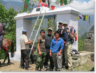 Dave and Joanne pose for a shot with Min and the porters at the entrance gate to Lukla, the end of the trek.