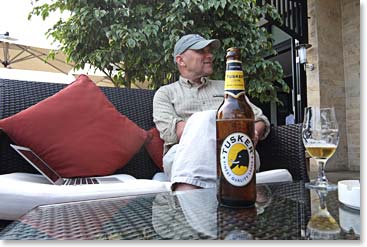 Catching up at the hotel with a Tanzanian staple, Tusker Beer. 