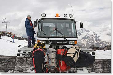 Vladimir helping to load Autur's snowcat