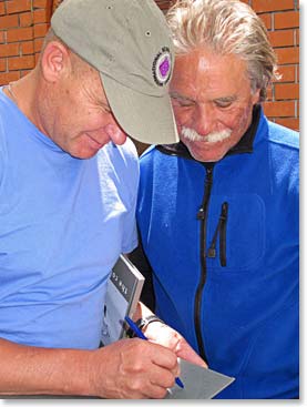 Toli signing one of his books for Lennie