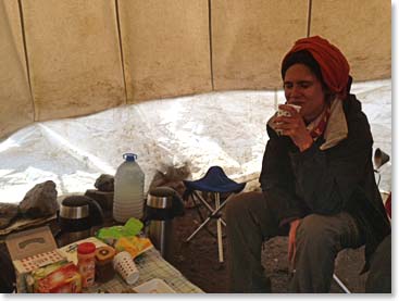 Duygu relaxing with a cup of tea at high camp
