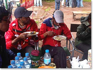 Minni and Ajei having their last meal on the mountain