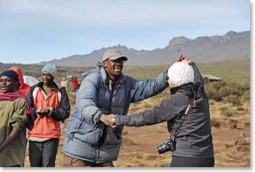 John, BAI guide, and Marielle dancing