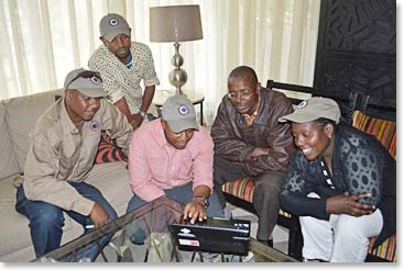 While the group showered, Berg Adventures staff enjoyed reviewing the dispatches from safari in the lobby.