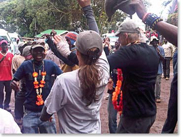 The climbers are greeted by song…