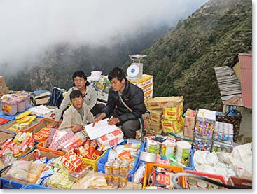 Goods are spread on the ground by dozens of different merchants.