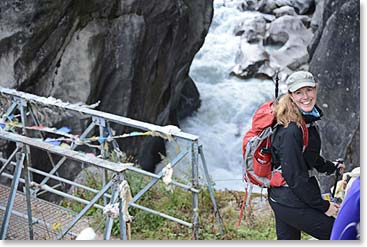 The Bhode Kosi river runs from the Nanpa La and the Tibetan border, past Thame. We crossed our most spectacular bridge of the trip just before we arrived at Kami’s lodge. It spanned a narrow gorge. Tina was excited before she crossed the bridge.