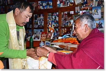 Temba skillful translated and assisted Geshe with the materials he was using to offer blessing to us.