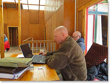As usual, Wally is working away on a laptop.