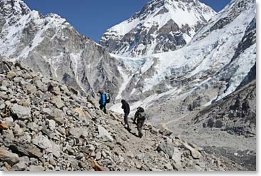 Temba, Liz and Fred on the trail to Gorak Shep. Just over their head is the Lho La, the pass into Tibet.  Changtse, the north summit of Everest and entirely in China, stands behind.