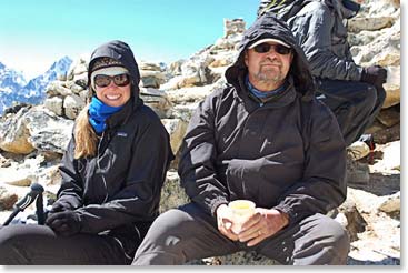 On the summit, Tina and Gerry enjoy a cup of tea carried in a thermos by the Sherpas.