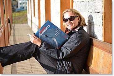 Lauren relaxing with a good read on the final afternoon trekking