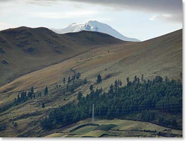 Cayambe peeking out of the clouds- our climbing goal for tomorrow