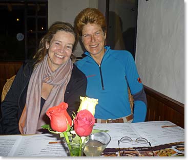 Chris and Leila with big smiles during dinner