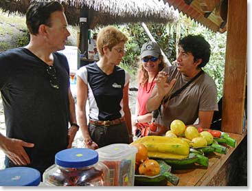 Joaquin explaining to Jeremy and Chris, the different assortment of fruits and flavors at a local juice stand