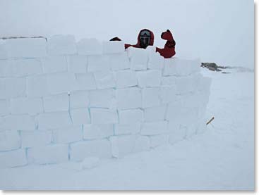 This wall is so high up you cannot see the tent behind it.