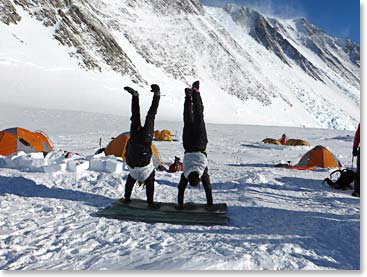 Winslow and Pachi (dressed as penguins) doing handstands at Low Camp 9,000 ft. (2,743 m)