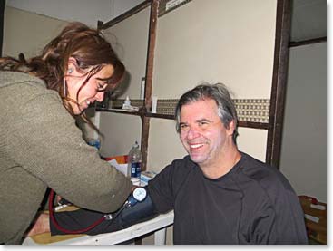 Andrea taking Dan’s blood pressure