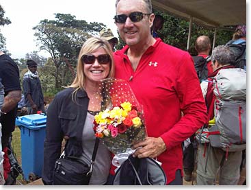 Mairin gifting Bob with flowers