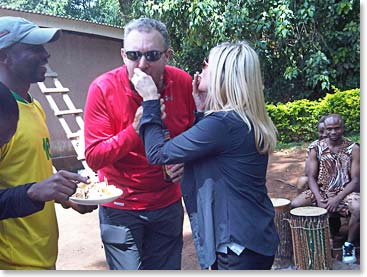 Mairin and Bob feeding each other cake