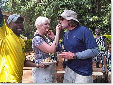 Terri and Bill feeding each other cake