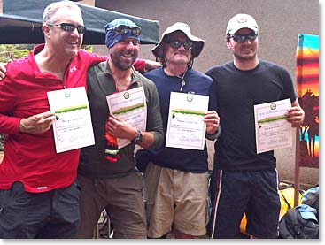 Group shot of the four climbers with their certificates in hand