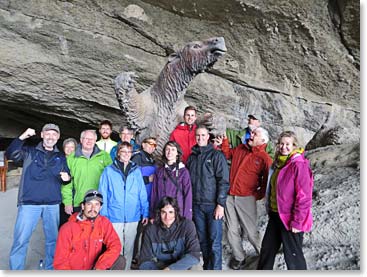 The team poses for a photo with a prehistoric Milodon before continuing toward Torres del Paine.