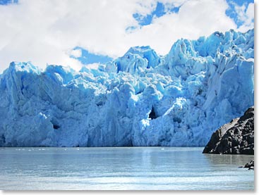 The glacier has a striking blue coloration