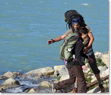 Laura being helped by Felipe on a river crossing