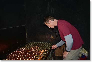 Later Todd lit butter lamps inside the monastery.