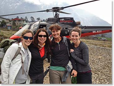 Cassidy Moran, Katie Branham, Joanne Howes, and Katie Ross Posing with the helicopter. Everyone is in Lukla now except Temba, who will fly in tomorrow AM. 