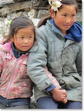 School is out for a brief time, so these young girls were relaxing along the trail.