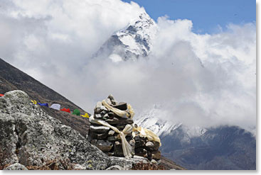 Fresh khatas and prayer flags adorn one of the memorials