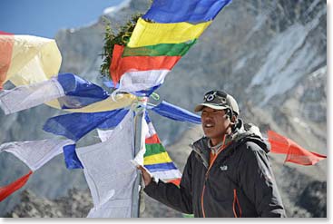 Dawa our lead climbing Sherpa, raised the flags from the chorten.