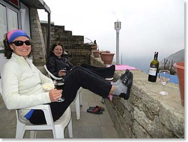 Why we love Panorama Lodge, Part 3.  Right after yoga, Joanne and Katie Braham relaxed with a bottle of wine outside their room. 