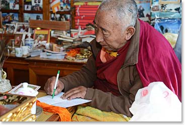 Temba gave Lama Geshe each of our names, which he translated into Tibetan as he wrote a personal message to each of us.