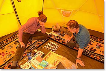 Our “Yoga Lounge” tent is one of the most popular places to hang out at Base Camp.  Joanne and Ed enjoy a game of checkers on the Yoga Lounge on our first afternoon at Base Camp.
