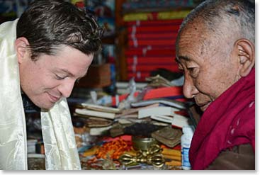 Daniel receives a blessing from Lama Geshi