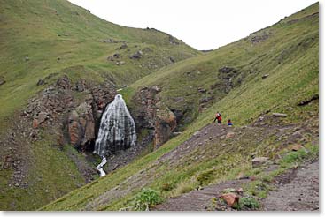 The group spots a waterfall and decides it will be a great place to stop for lunch.