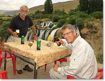 Evert Broekers and Peter Broekveldt enjoy a beverage with a beautiful view.