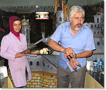 The owner of the restaurant came to display the dinner options.