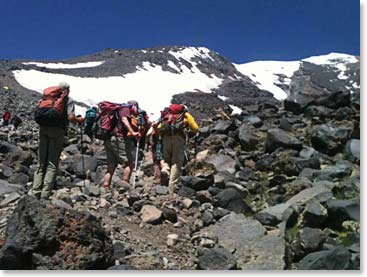 The team making the last steps into high camp with our goal, Mount Ararat above us (the actual summit is behind the high point on the right).