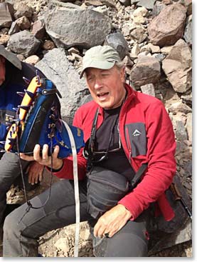 Charles with his correctly adjusted crampon. For Charles we had a difficult decision - which boots to wear to the summit- his larger double boots or single leather - the crampons fit both boots perfectly. Charles decided to follow Wally’s advice and go with the double boots for the climb.